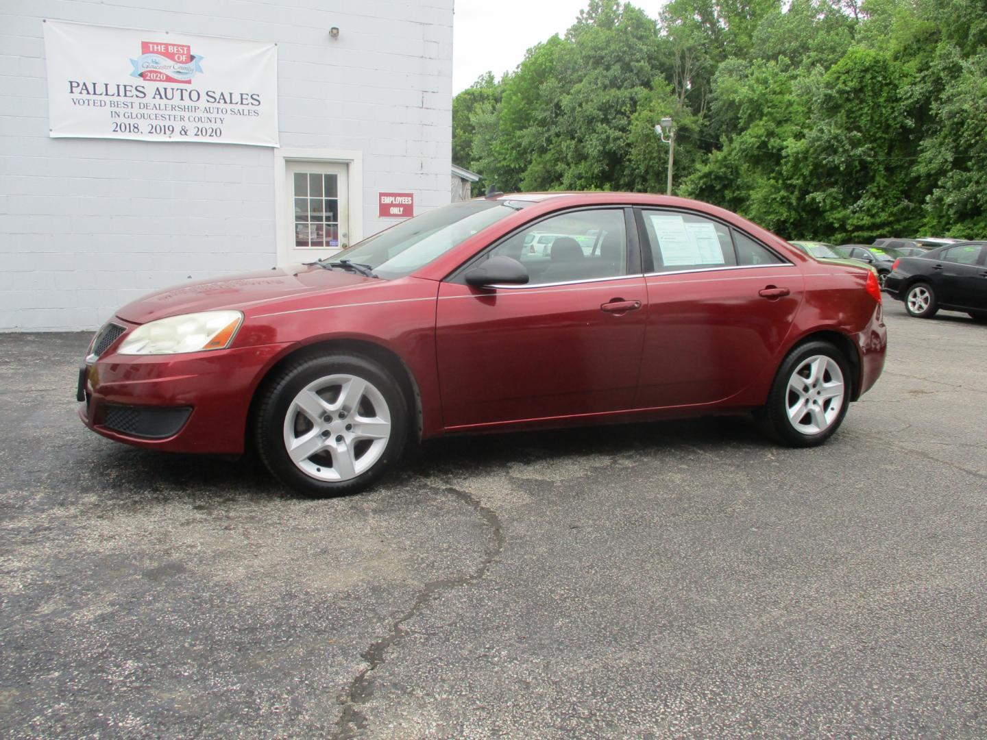 2009 RED Pontiac G6 Sedan (1G2ZJ57B994) with an 2.4L L4 DOHC 16V engine, 4-Speed Automatic transmission, located at 540a Delsea Drive, Sewell, NJ, 08080, (856) 589-6888, 39.752560, -75.111206 - Photo#1